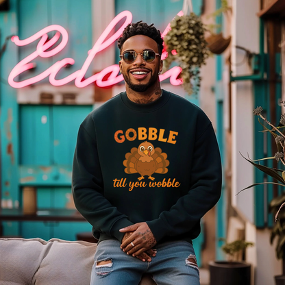 Man wearing a black sweatshirt with a turkey graphic and text, sitting in front of a colorful background.